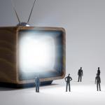 Tiny people and a vintage TV set