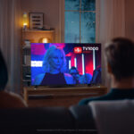 Couple,Watches,Green,Mock-up,Screen,Tv,While,Sitting,On,A